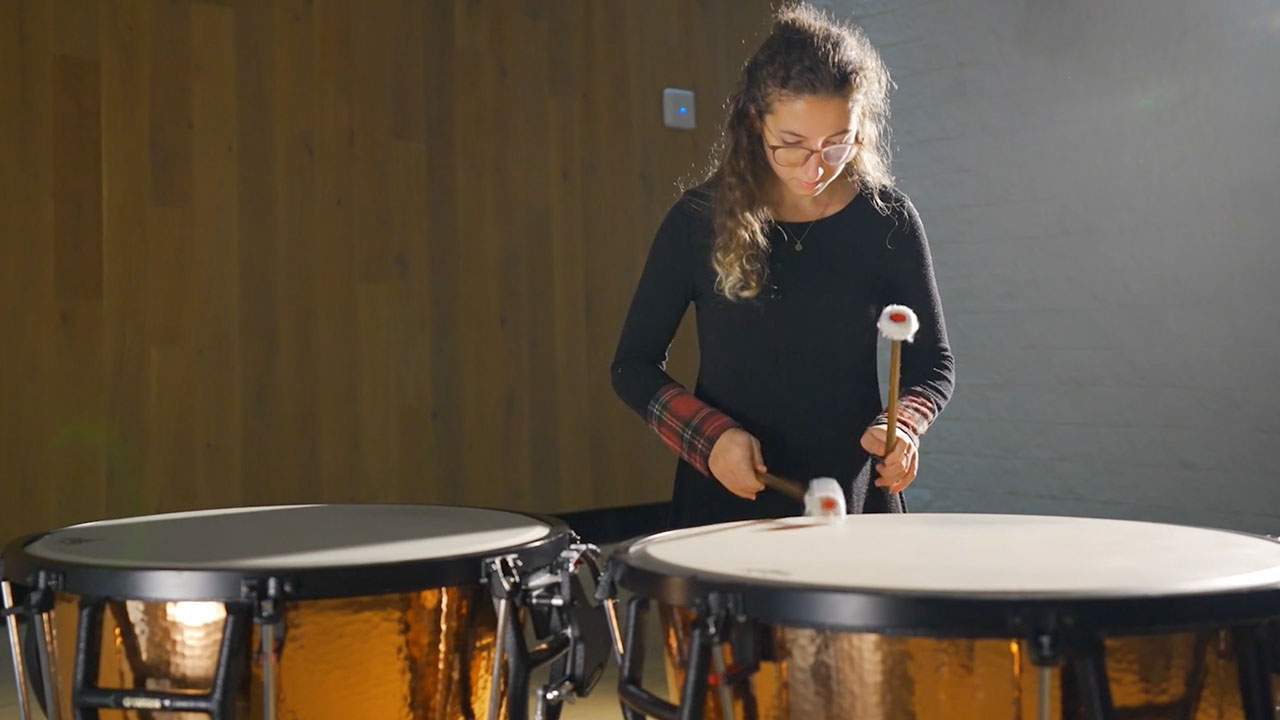 Photo of student using drums